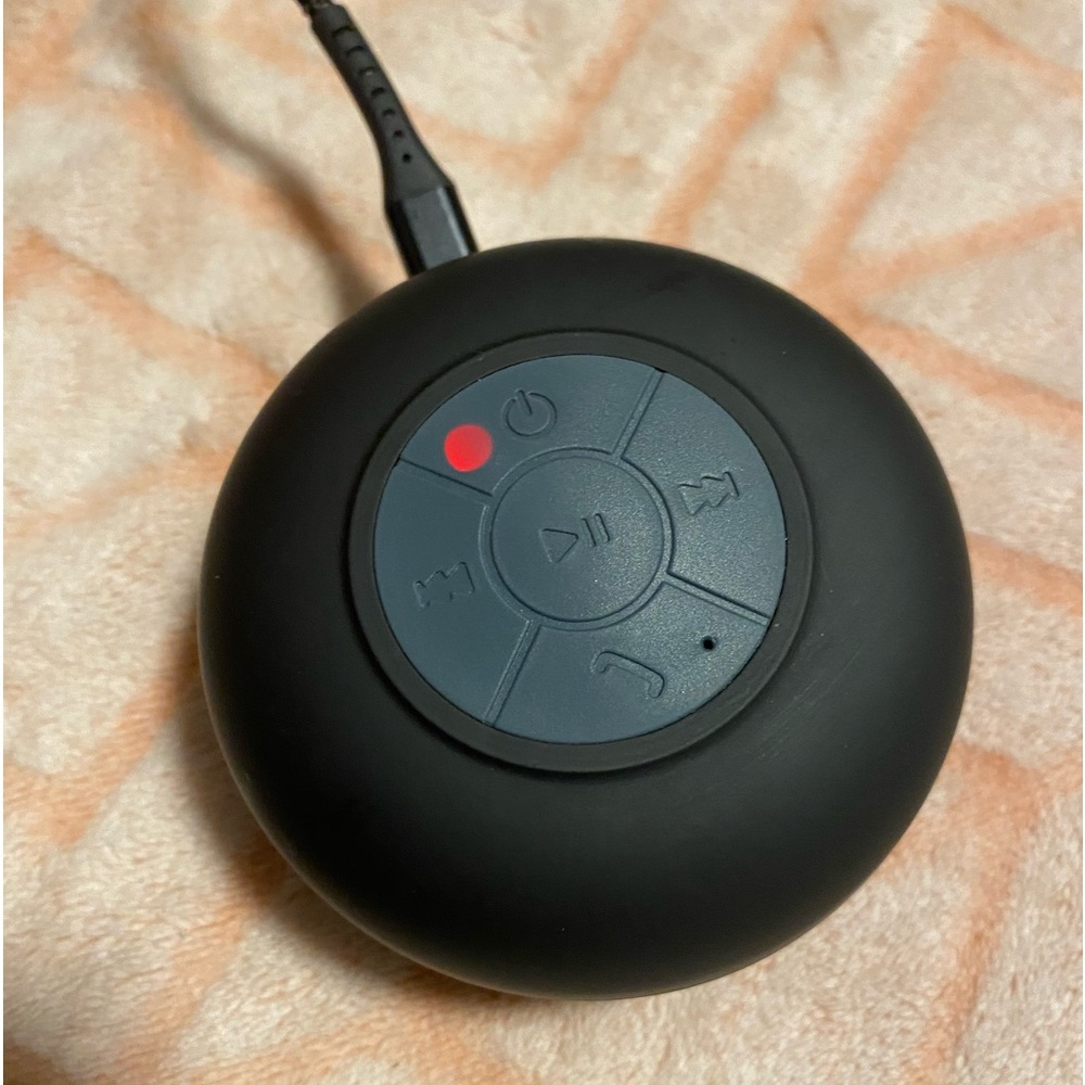 Wireless bluetooth® shower speaker with mic. Strong suction for shower safety.